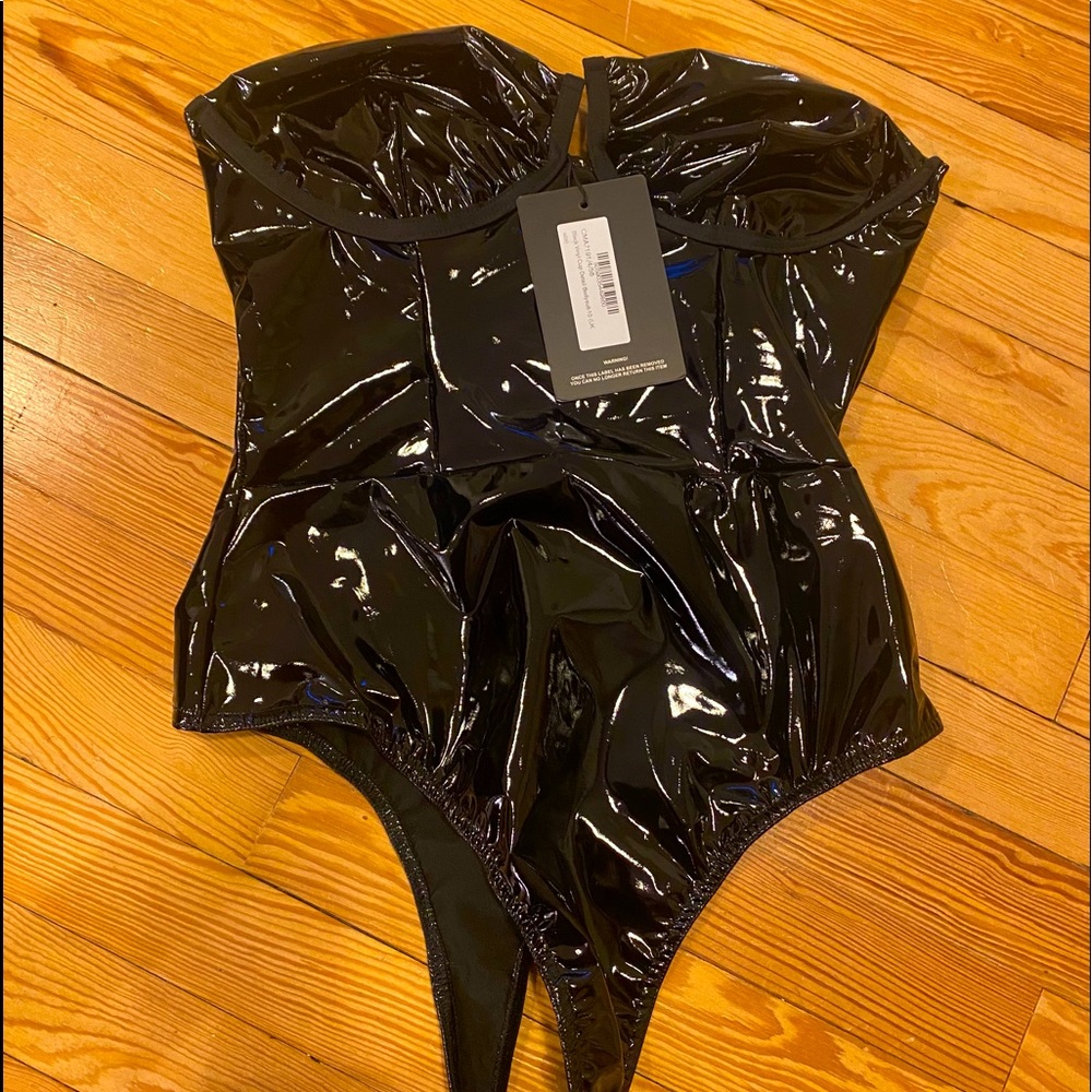 Brand new Black vinyl bodysuit. Too big for me